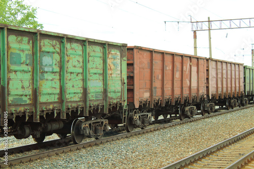 Freight railroad cars at the station. The train on the rails. Close-up.