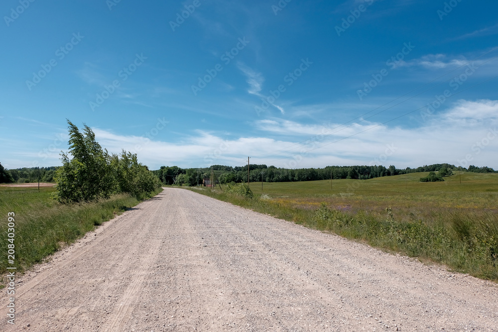 empty gravel road in the countryside in summer heat empty gravel road in the countryside in summer heat