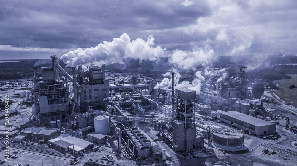 Industrial Manufacturing plant with smoke Industrial Manufacturing plant with smoke