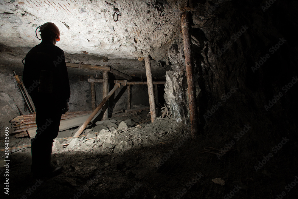 Underground emerald ore mine shaft tunnel gallery with light