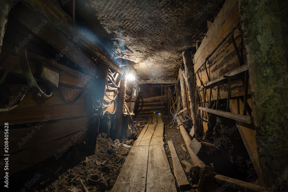Underground emerald ore mine shaft tunnel gallery with light Underground emerald ore mine shaft tunnel gallery with light