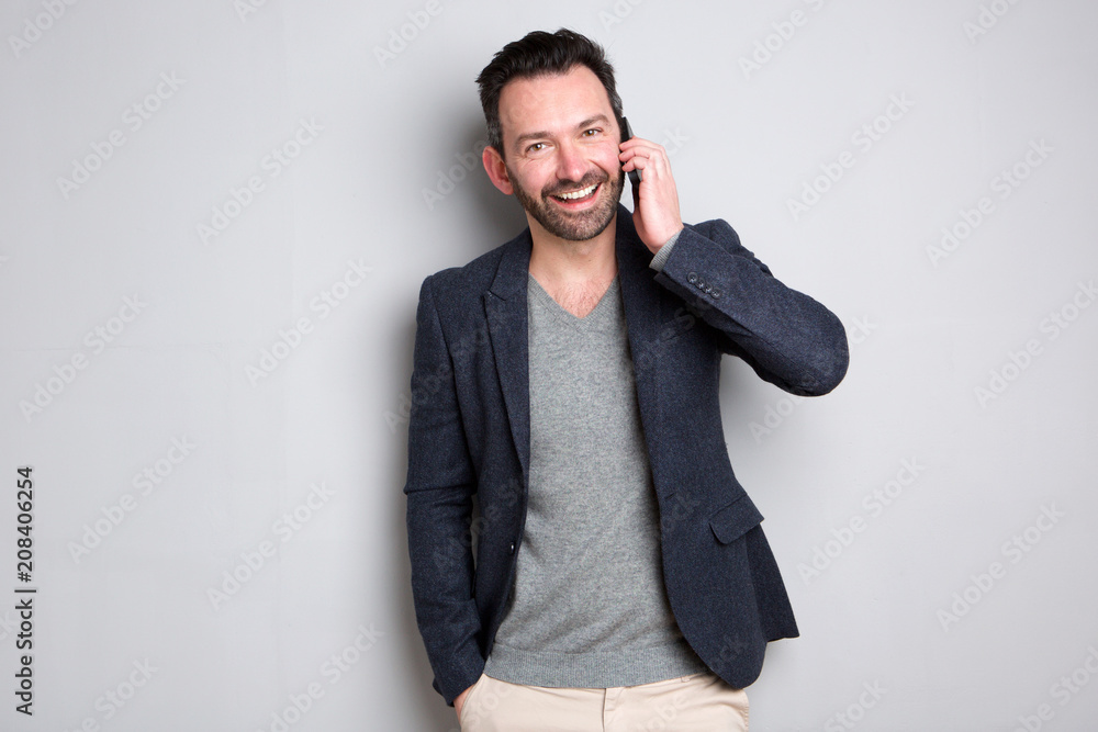 trendy man talking on mobile phone trendy man talking on mobile phone