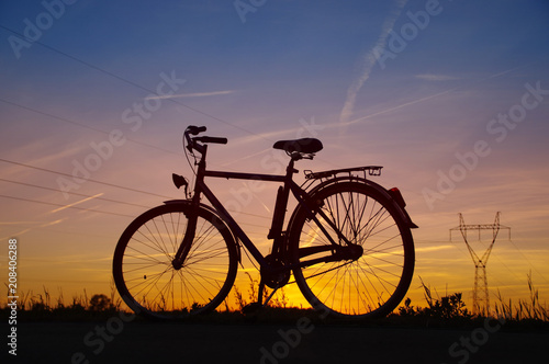 Bicycle silhouette on sunset
