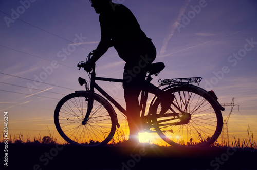 Fototapeta Naklejka Na Ścianę i Meble -  Man starting drive on bicycle