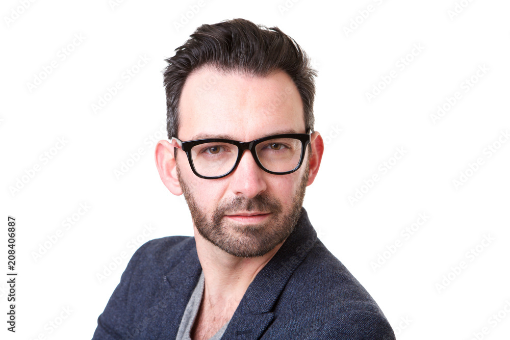 Close up serious man with beard and glasses posing against white background Close up serious man with beard and glasses posing against white background