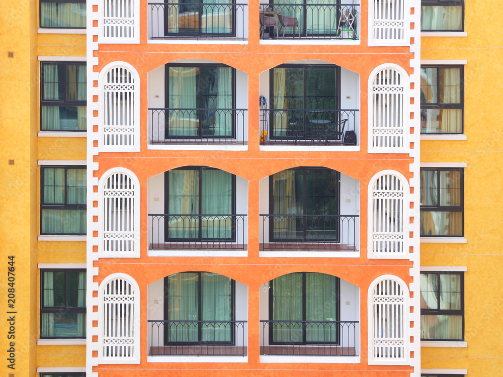 Horizontal condominium building multiple floor with balcony.