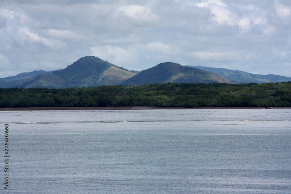 Coastal view of mountain range seen from a ferry ride from San Jose to La Playa Tambor, Costa Rica