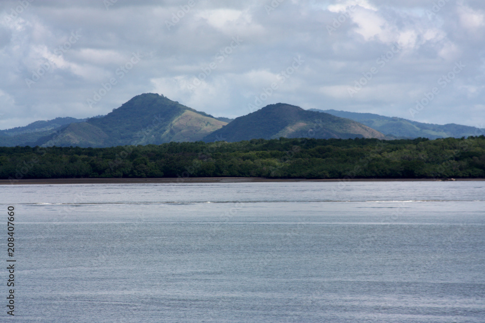 Coastal view of mountain range seen from a ferry ride from San Jose to La Playa Tambor, Costa Rica Coastal view of mountain range seen from a ferry ride from San Jose to La Playa Tambor, Costa Rica