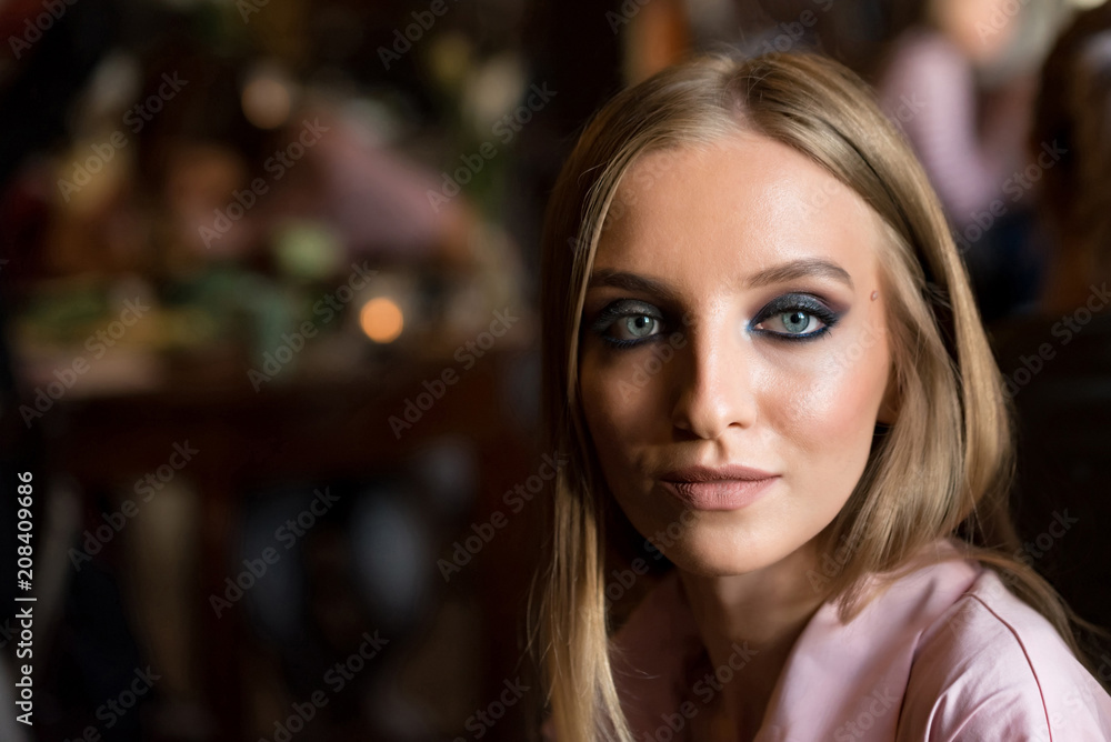 Portrait of pretty young blonde model in restaurant Portrait of pretty young blonde model in restaurant