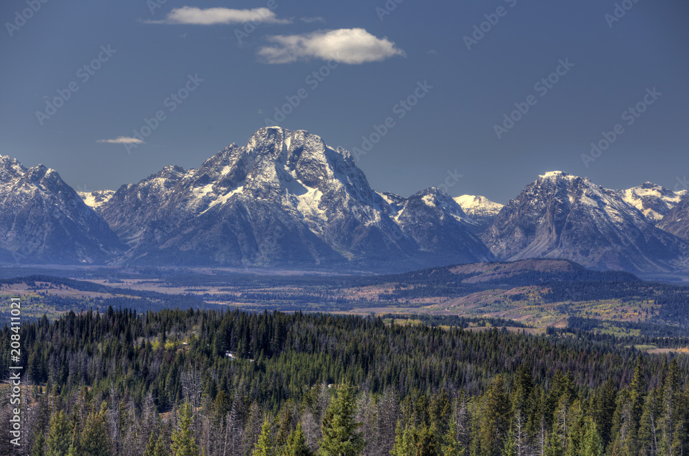 Grand Tetons in distance with forest and valley; Wyoming