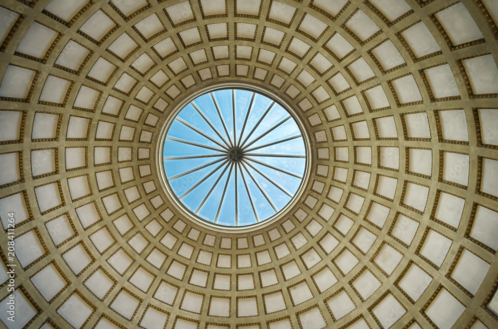 Dome with a stained glass. Dome of classical architecture building with a blue sky view