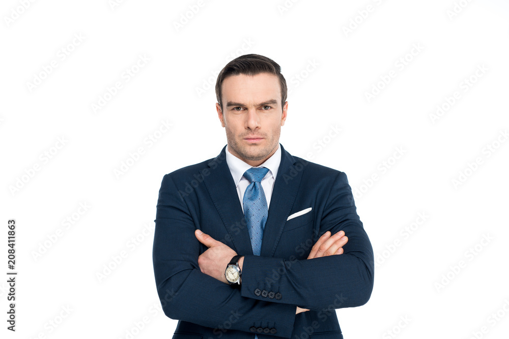confident businessman in formal wear standing with crossed arms and looking at camera isolated on white confident businessman in formal wear standing with crossed arms and looking at camera isolated on white