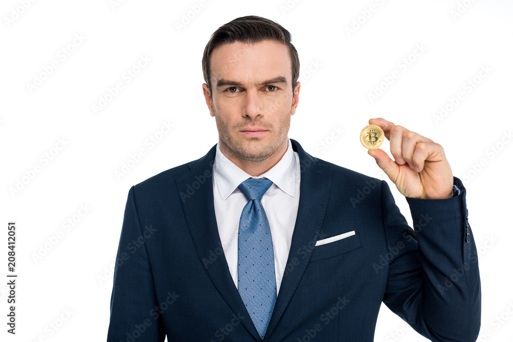 businessman holding bitcoin and looking at camera isolated on white businessman holding bitcoin and looking at camera isolated on white