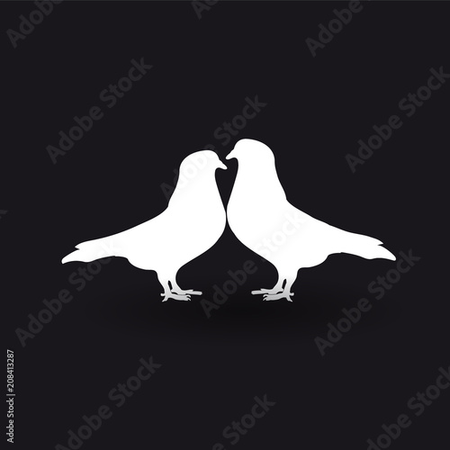 Silhouettes of two white doves on a black background.