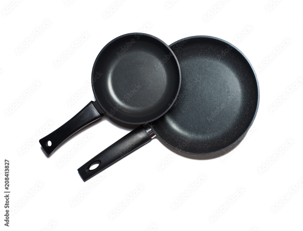Two new non-stick pans isolated on a white background. Two new non-stick pans isolated on a white background.