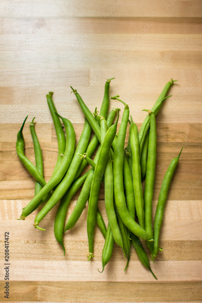 Bundle of green beans on butcher's block Bundle of green beans on butcher's block