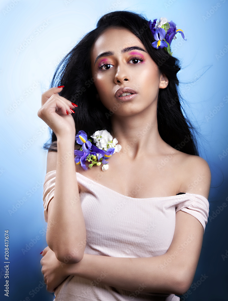 Young Arabic and middle eastern woman beauty model with beautiful hair and  natural lips showcases her
