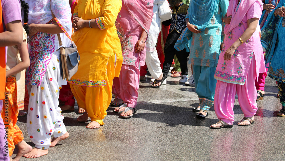 many barefoot woman during the religious ceremony