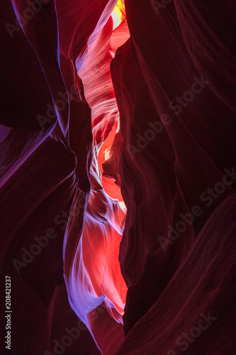 Beautiful wide angle view of amazing sandstone formations in famous Antelope Canyon on a sunny day with blue sky near the old town of Page at Lake Powell, American Southwest, Arizona, USA