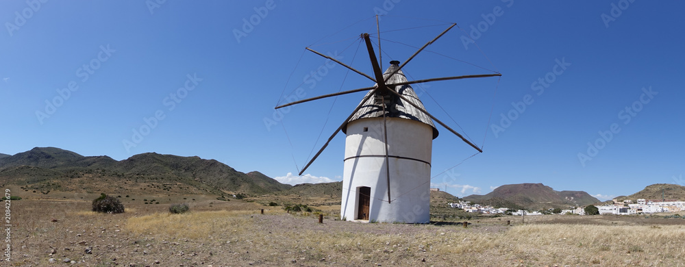 Windmill under blue sky in Almeria, Andalucia