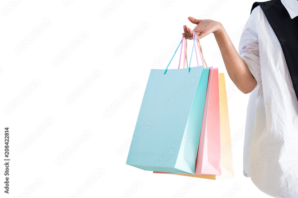 Woman hand holding many colorful shopping bag with copy space on white background. Isolated