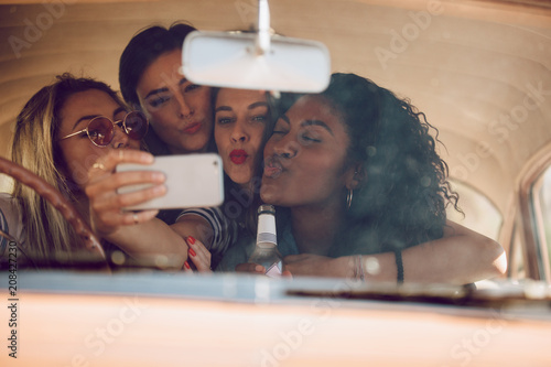 Photography Girls taking selfie on a road trip