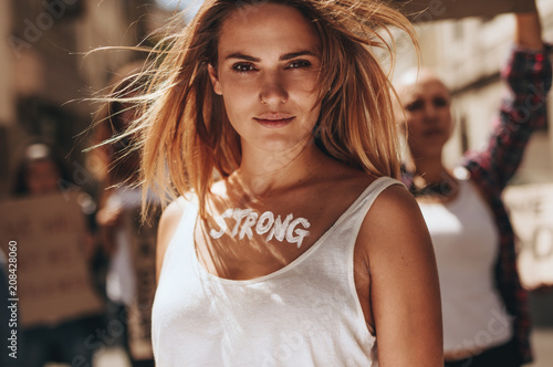 Female demonstrating strength of women photo