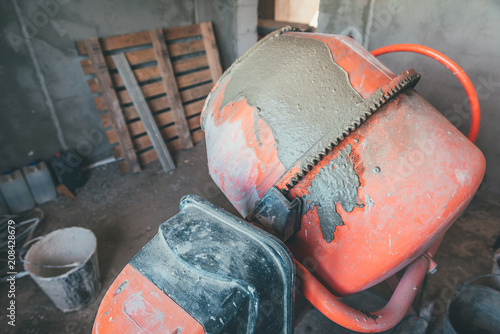 Cement concrete mixer at a construction site.
