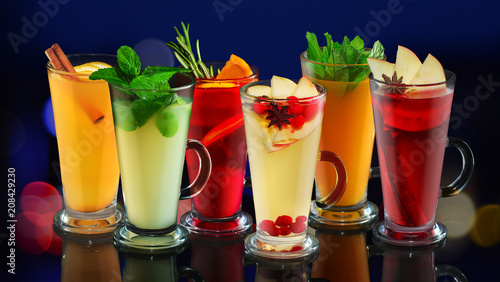 Set of tasty fruit tea in cups