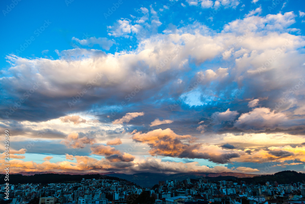 Spectacular sky with clouds of various colors, over the city of Quito