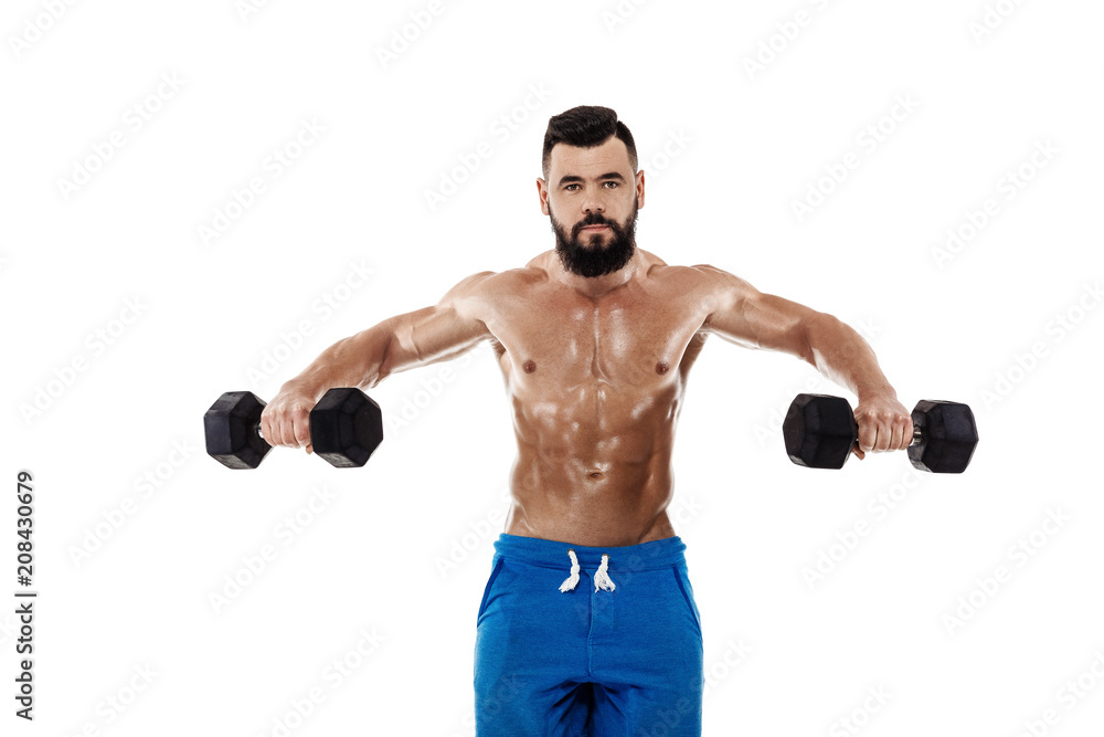 muscular man doing exercises with dumbbells. muscular man doing exercises with dumbbells.