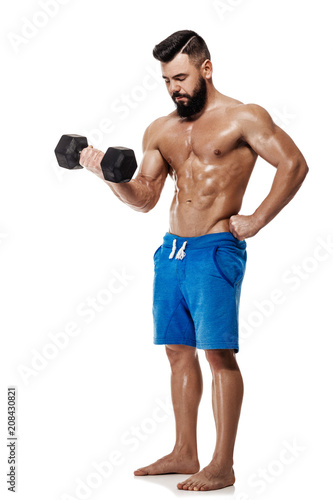 muscular man doing exercises with dumbbells.