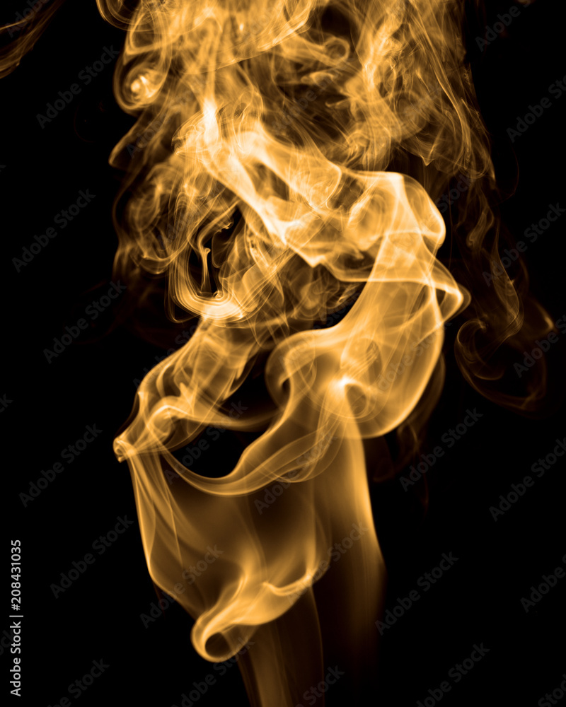 Smoke rising against black background