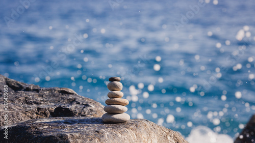 Balanced stone on a peddle beach 
