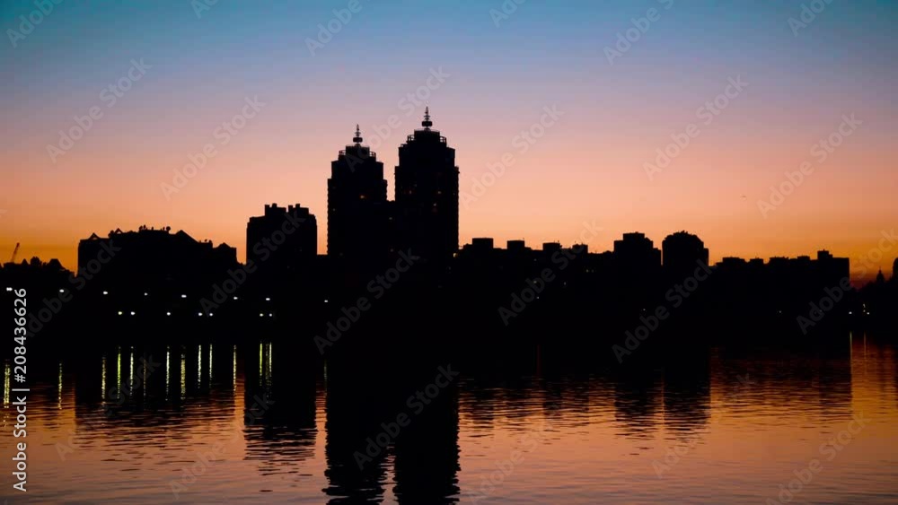 Perfect sunset on city landscape while bird flying Perfect sunset on city landscape while bird flying