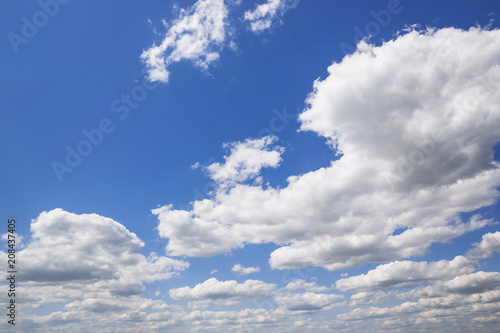 Blue sky with white puffy clouds. Clouds in the blue sky. © Flash-Stock