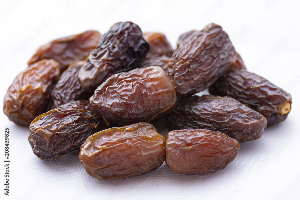 dried dates on a white background dried dates on a white background