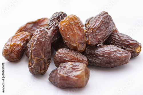 dried dates on a white background
