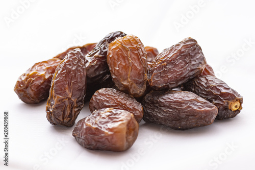 dried dates on a white background