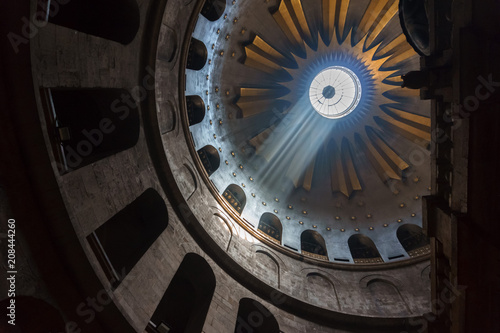 Jerusalem , Israel - March 11, 2018 : The Holy Sepulchre Church in the Old City of Jerusalem. Light goes through the dome of the church.