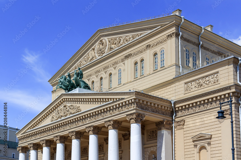 Facade of Bolshoi Theatre closeup on a blue sky background on a sunny summer morning