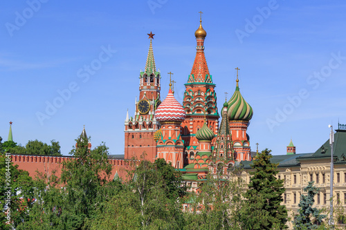 St. Basil's Cathedral with Moscow Kremlin on a blue sky background on a sunny summer morning