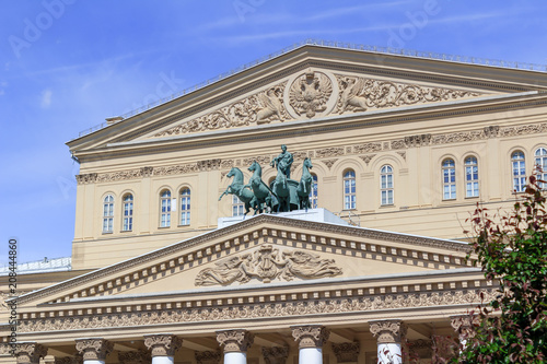 Facade of Bolshoi Theatre on a blue sky background on a sunny summer morning