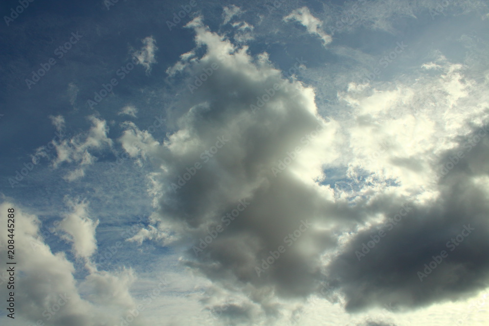 Fototapeta premium Beautiful blue sky and gray cumulus clouds. Natural appearance. Landscape. Background.