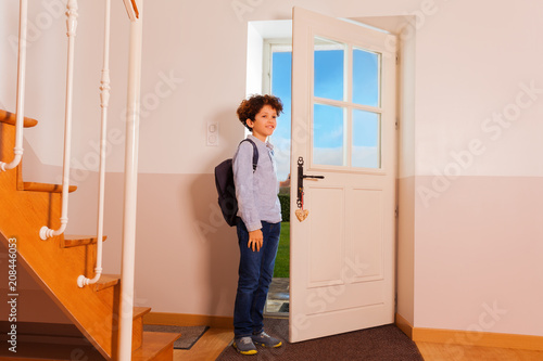 Photos Preteen boy coming back home from school