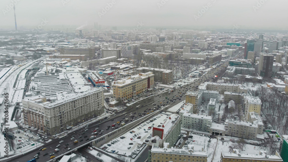 Moscow cloudy day aerial shot above high load traffic cross junction. Moscow cloudy day aerial shot above high load traffic cross junction.