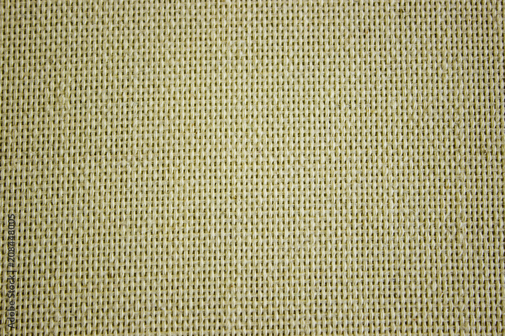 Fototapeta premium Rough canvas yellow canvas. Texture of coarse cloth, burlap