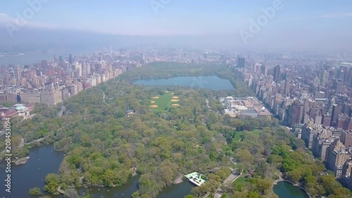 Aerial view of Central Park, New York, USA, Skyscrapers on background. Luxury residential buildings.