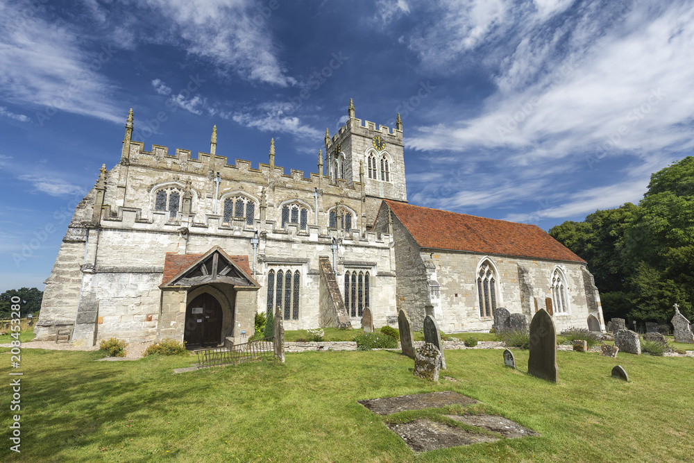 Fototapeta premium Summer sky over the Saxon Sanctuary Church in Wootton Wawen, England.