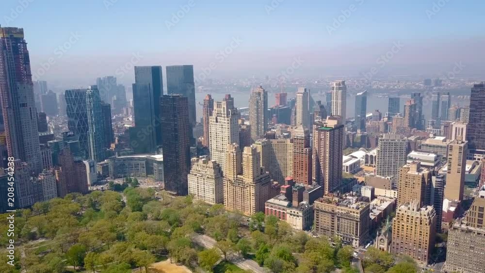Aerial view of Central Park, New York, USA, Skyscrapers on background. Luxury residential buildings. Aerial view of Central Park, New York, USA, Skyscrapers on background. Luxury residential buildings.